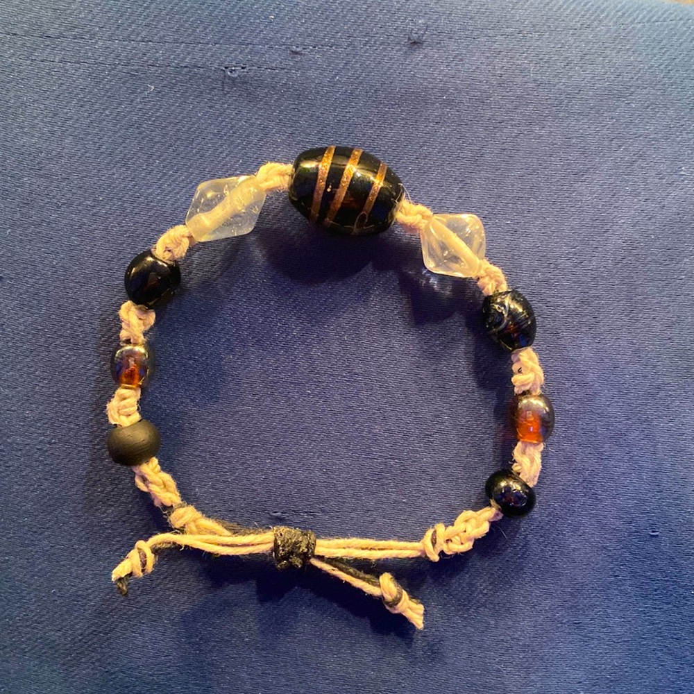 Bracelet is made with hemp, beads are glass, slipknot class for comfort